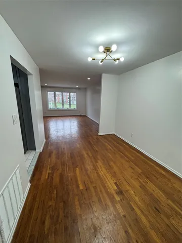 wooden floor in a hall with an entryway