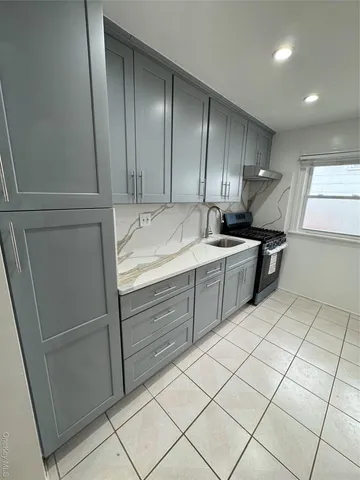 a kitchen with a cabinets and steel appliances