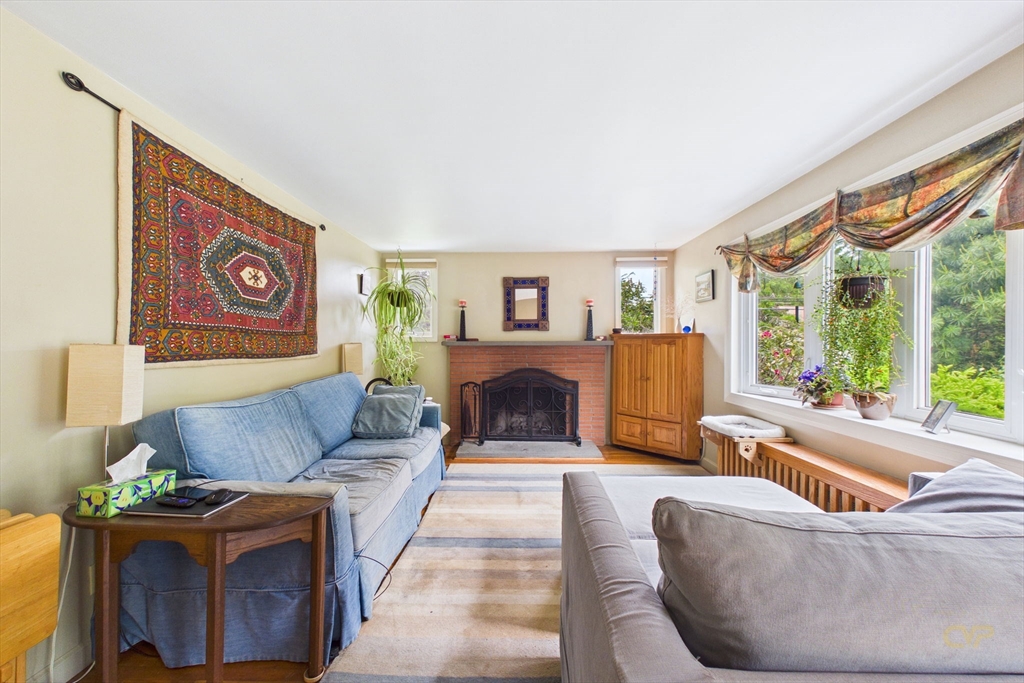 70 Neponset Street Canton, MA 02021 - Photo 5 of 39 a living room with furniture and a fireplace