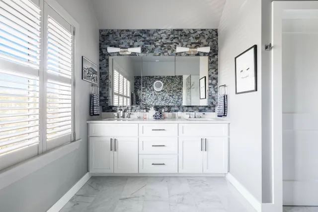 a bathroom with a sink a vanity and a mirror