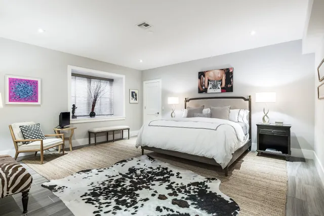 a bedroom with a bed and a couch