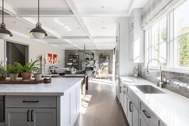 a kitchen with a sink stove and cabinets