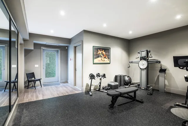 a living room with furniture a rug and a table