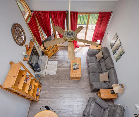 a view of living room with furniture and a window