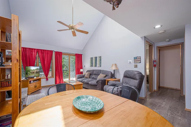 a living room with furniture a rug and a window