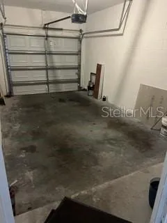 a kitchen with kitchen island granite countertop a sink stove and refrigerator