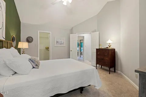 a bedroom with a bed and dresser