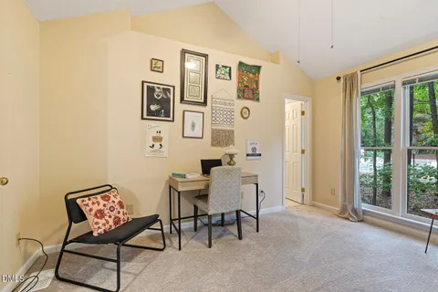 a view of a livingroom with furniture and windows
