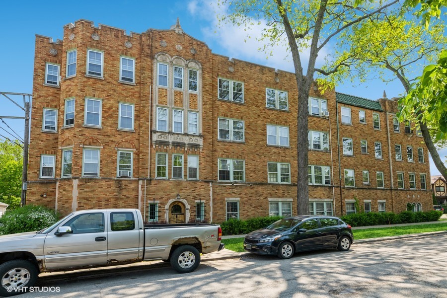 6881 North Overhill Avenue, Unit 1 Chicago, IL 60631 - Photo 15 of 17 a car parked in front of a building