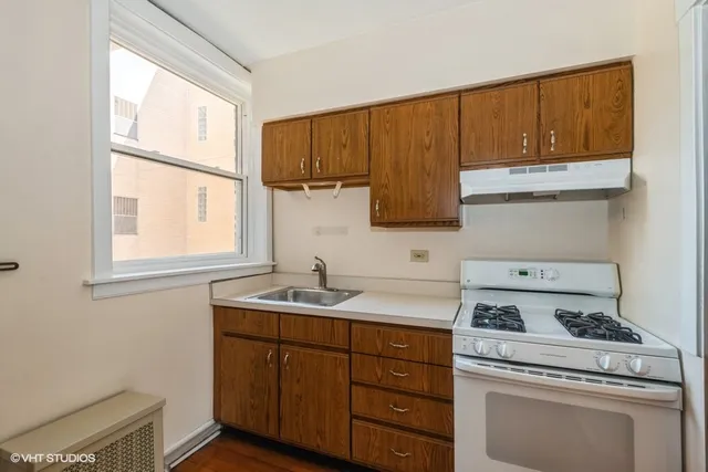 a white refrigerator freezer sitting inside of a kitchen