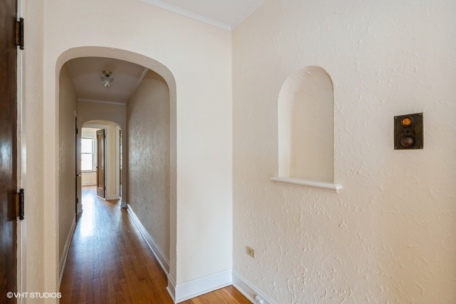 6881 North Overhill Avenue, Unit 1 Chicago, IL 60631 - Photo 8 of 17 a view of a hallway with wooden floor