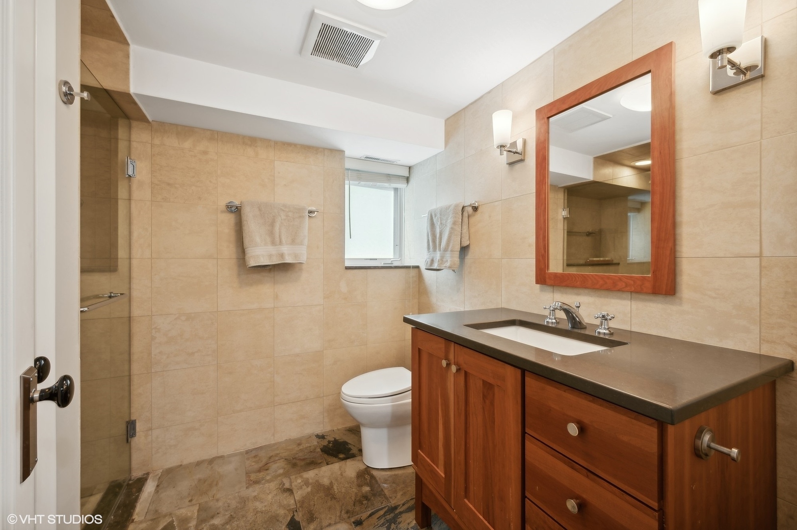 2201 Forestview Road Evanston, IL 60201 - Photo 17 of 27 a bathroom with a sink and a mirror