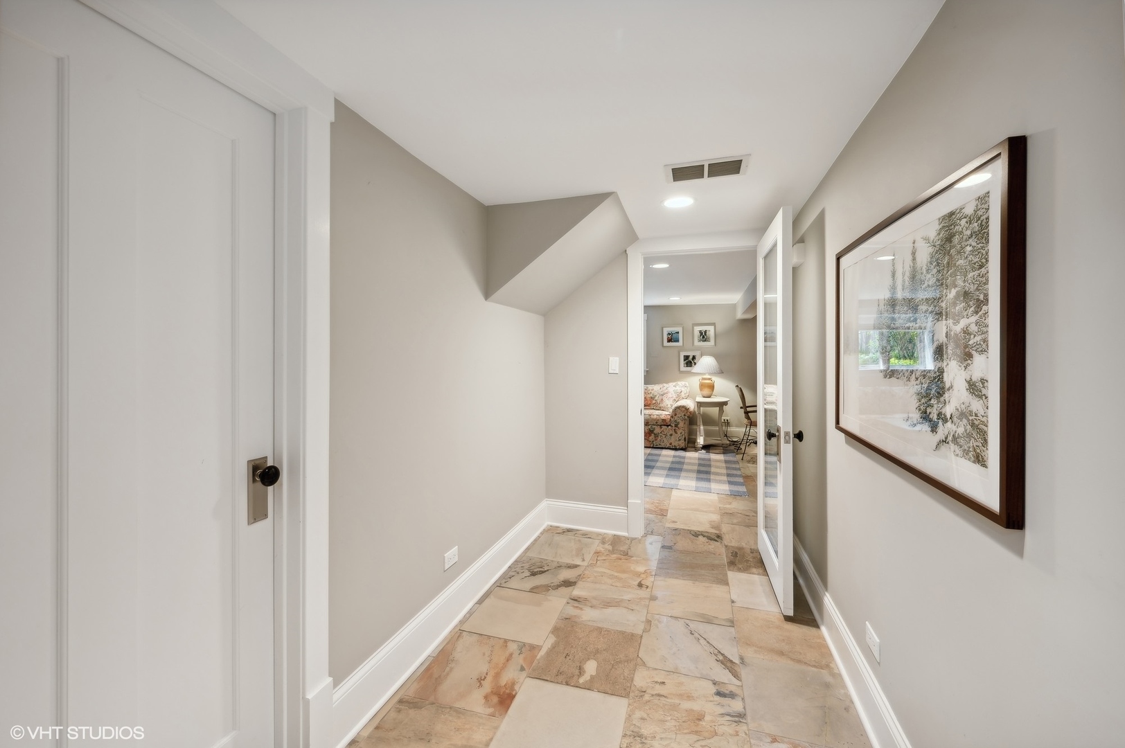 2201 Forestview Road Evanston, IL 60201 - Photo 19 of 27 a hallway with a dining table and chairs