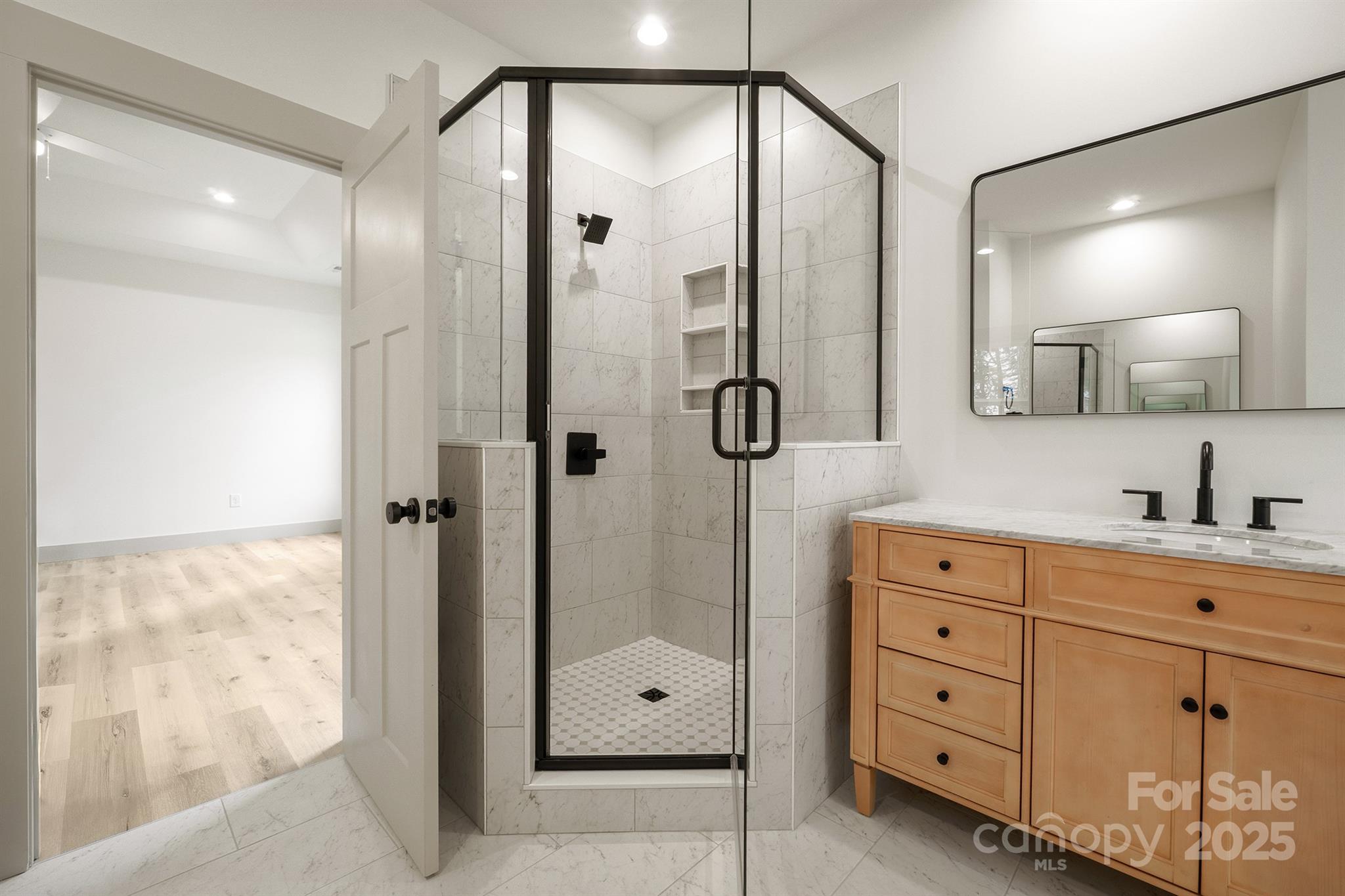 1568 Pleasant Grove Church Road Crouse, NC 28033 - Photo 29 of 48 a bathroom with a shower sink and mirror