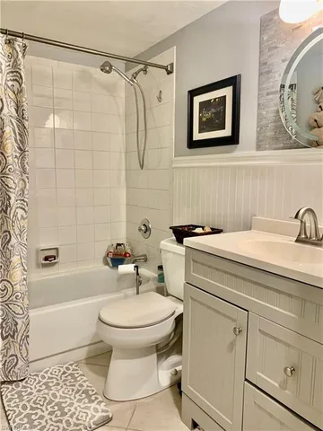 a bathroom with a toilet sink and shower