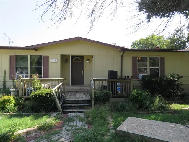 a house view with a garden space