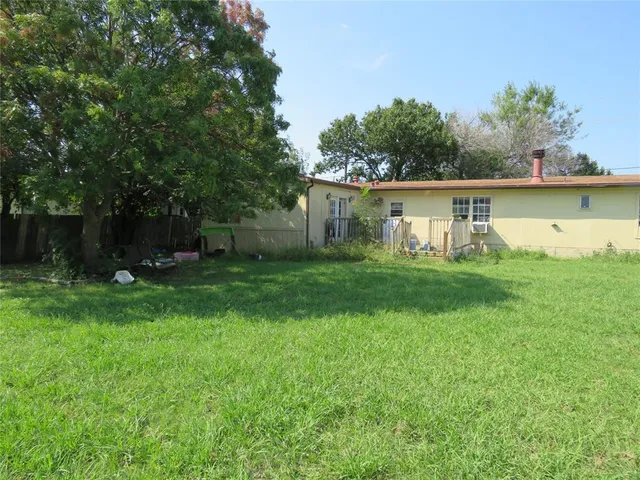 a backyard of a house with lots of green space