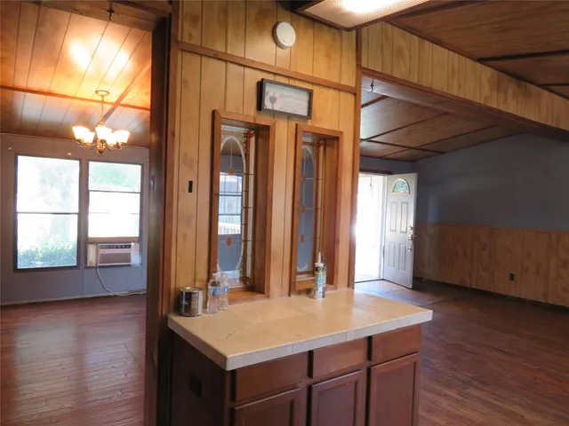 a bathroom with a window and a shower