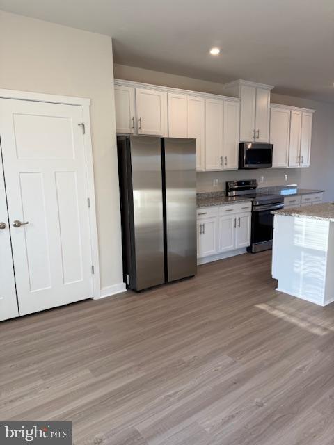 85 Tumblehome Road Inwood, WV 25428 - Photo 13 of 24 Modern kitchen with sleek finishes.