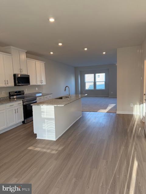 85 Tumblehome Road Inwood, WV 25428 - Photo 14 of 24 Modern kitchen with open living space.