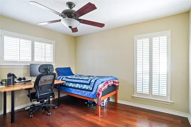 a bedroom with a workspace