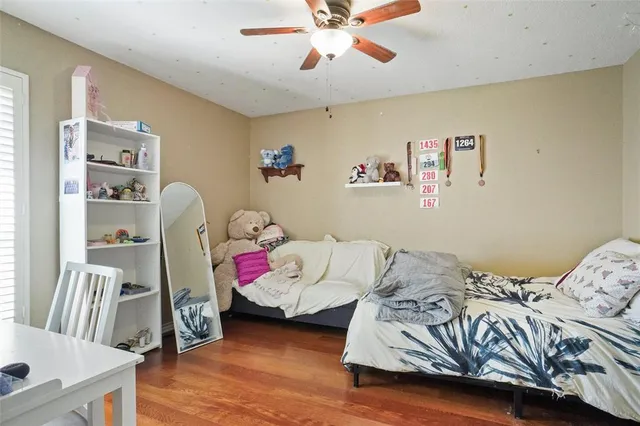 a bedroom with bed and a window