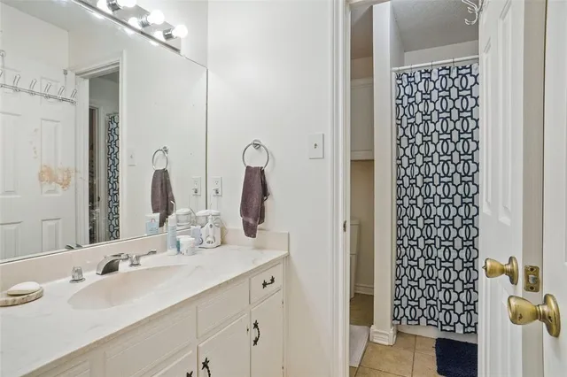 a bathroom with a double vanity sink and mirror