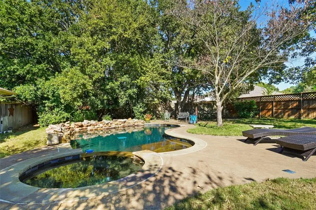 a garden view with a sitting area
