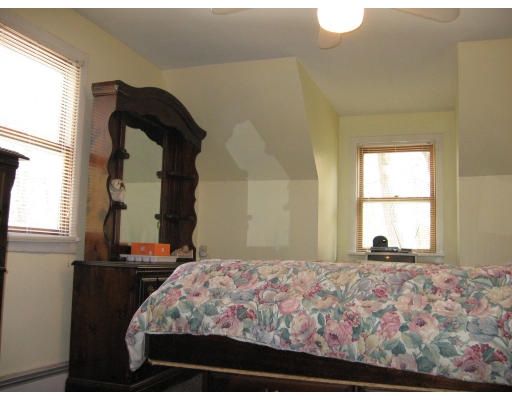 158 Rollins Street Springfield, MA 01109 - Photo 8 of 9 a bedroom with a bed and a window