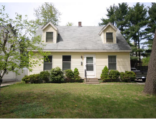 158 Rollins Street Springfield, MA 01109 - Photo 9 of 9 a front view of a house with a yard and trees
