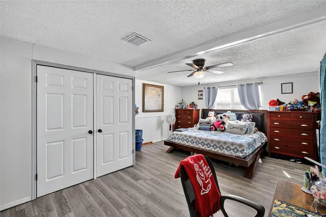 a living room with furniture fireplace and wooden floor