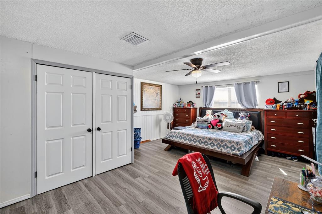3837 Darlington Road Holiday, FL 34691 - Photo 12 of 28 a living room with furniture fireplace and wooden floor