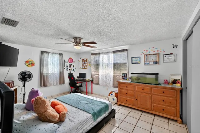 a bedroom with a bed and dresser