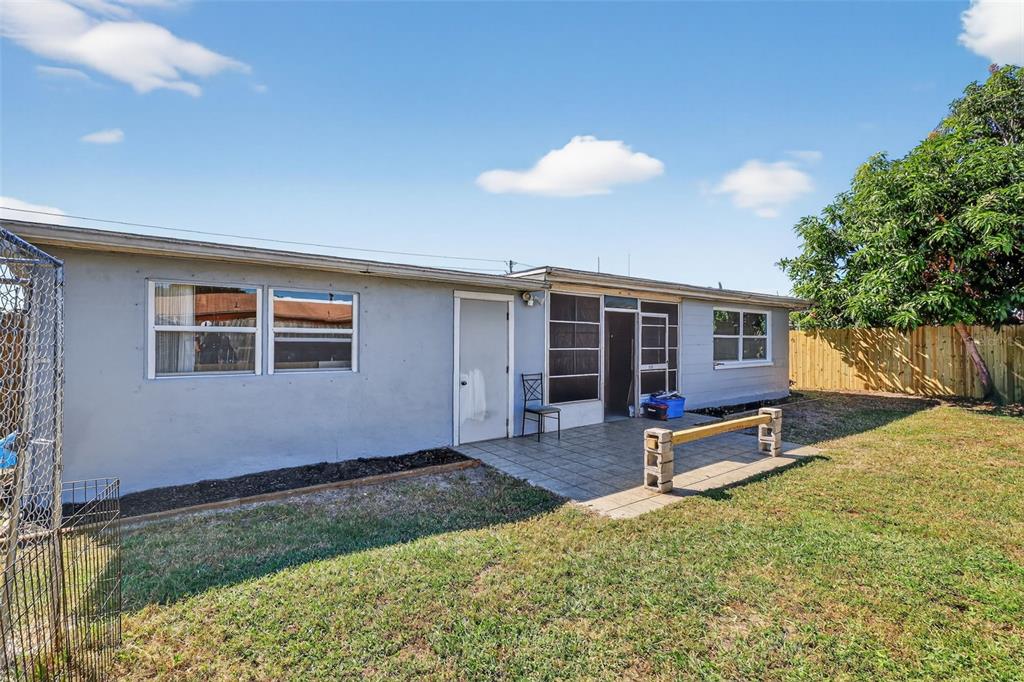 3837 Darlington Road Holiday, FL 34691 - Photo 21 of 28 a view of a house with backyard porch and sitting area