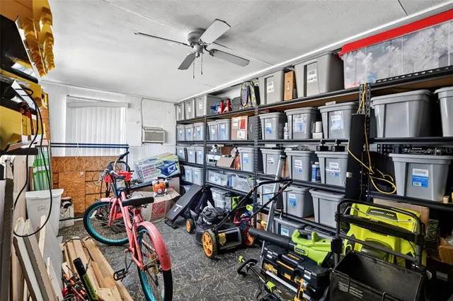 a view of a big house with a big yard and potted plants