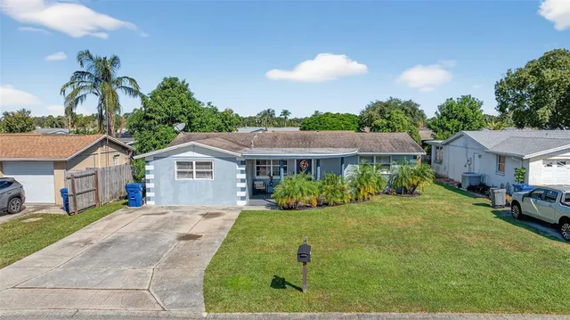an aerial view of a house with a swimming pool outdoor seating and yard view