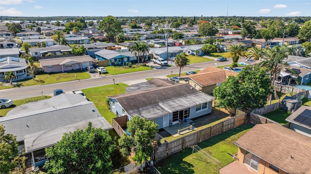 3837 Darlington Road Holiday, FL 34691 - Photo 27 of 28 an aerial view of a house with a swimming pool yard and outdoor seating