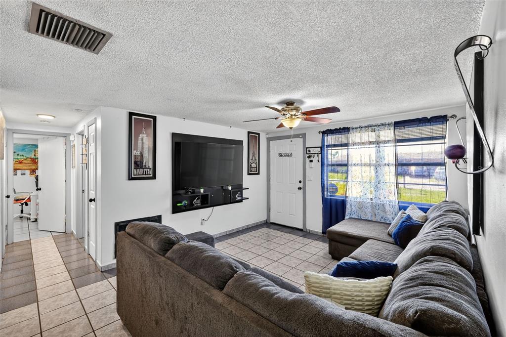 3837 Darlington Road Holiday, FL 34691 - Photo 5 of 28 a living room with furniture and a flat screen tv