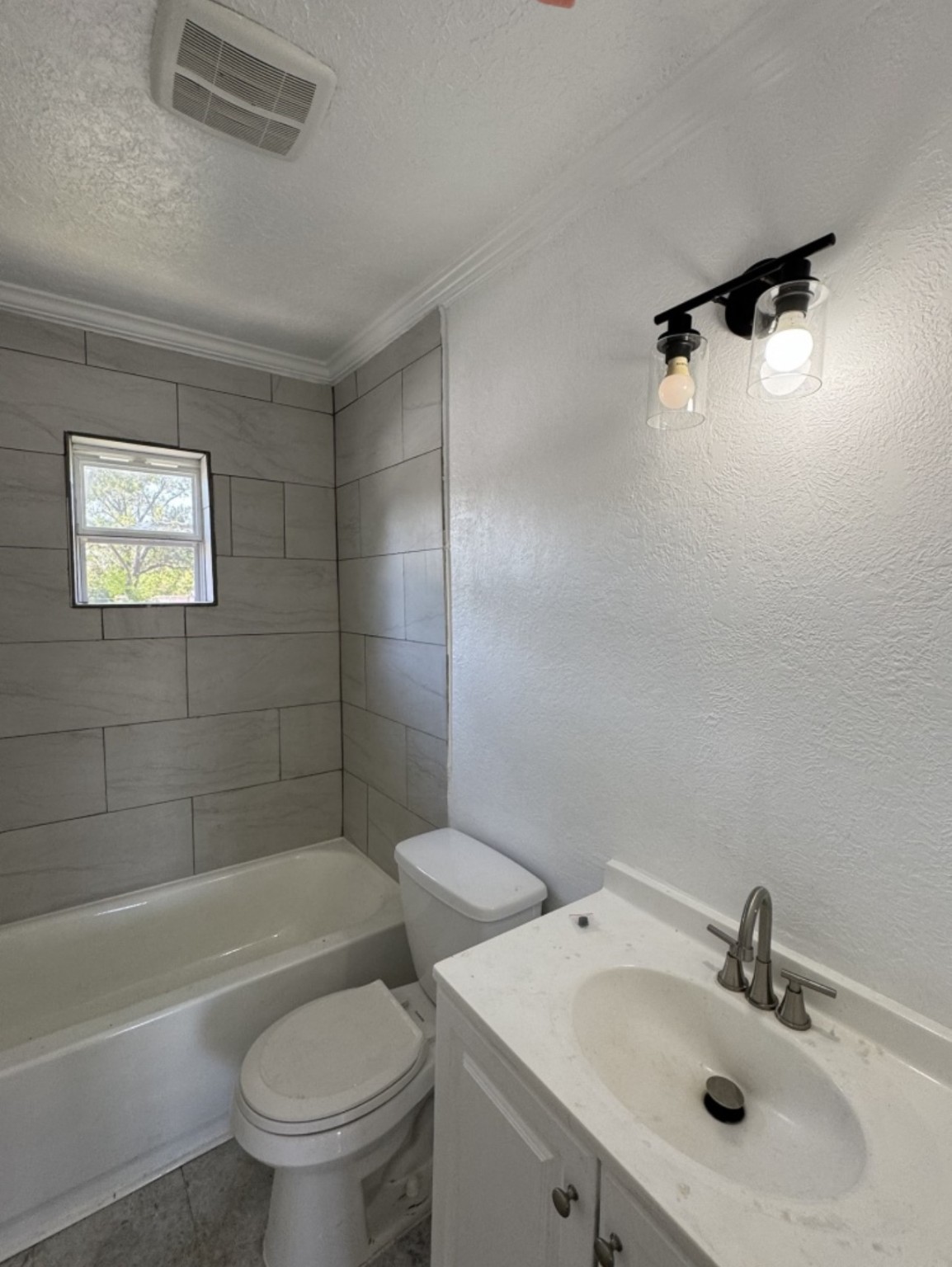 923 Knight Street, Unit A2 Houston, TX 77022 - Photo 6 of 7 a bathroom with a sink toilet and shower