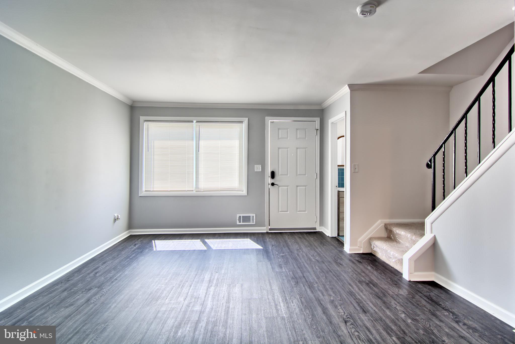 4214 Labyrinth Road Baltimore, MD 21215 - Photo 3 of 16 Updated Living Room with new Floor & Crown Molding
