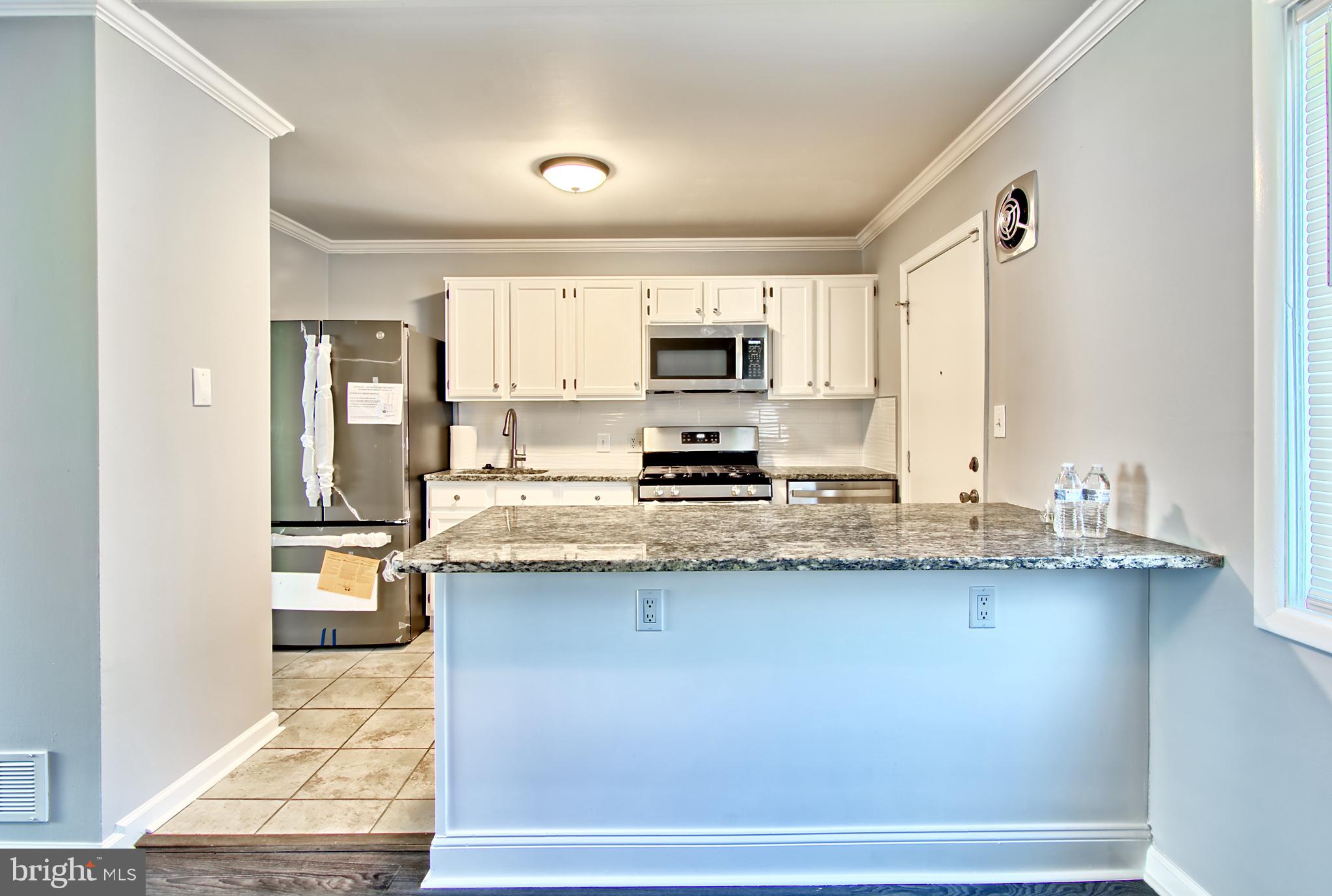 4214 Labyrinth Road Baltimore, MD 21215 - Photo 6 of 16 Renovated Kitchen w/Granite and SS Appl-s