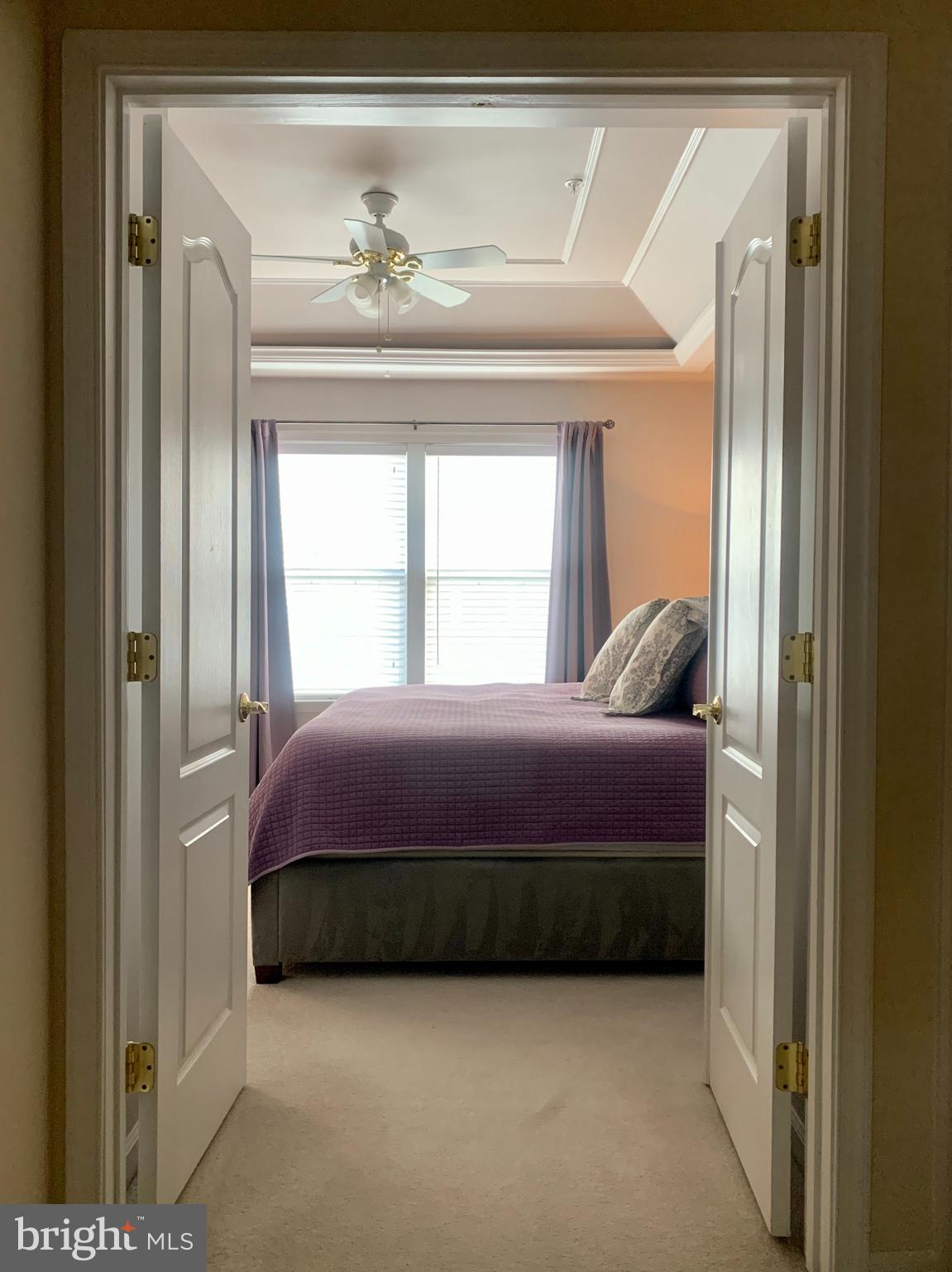 9823 Darcy Forest Drive Silver Spring, MD 20910 - Photo 14 of 32 a bedroom with a bed and a window