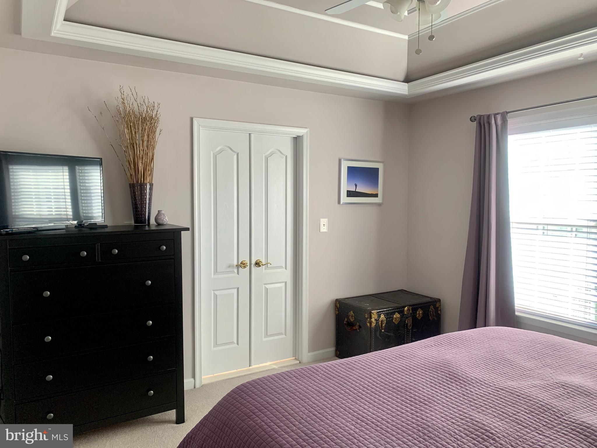 9823 Darcy Forest Drive Silver Spring, MD 20910 - Photo 15 of 32 a bedroom with a bed and a closet