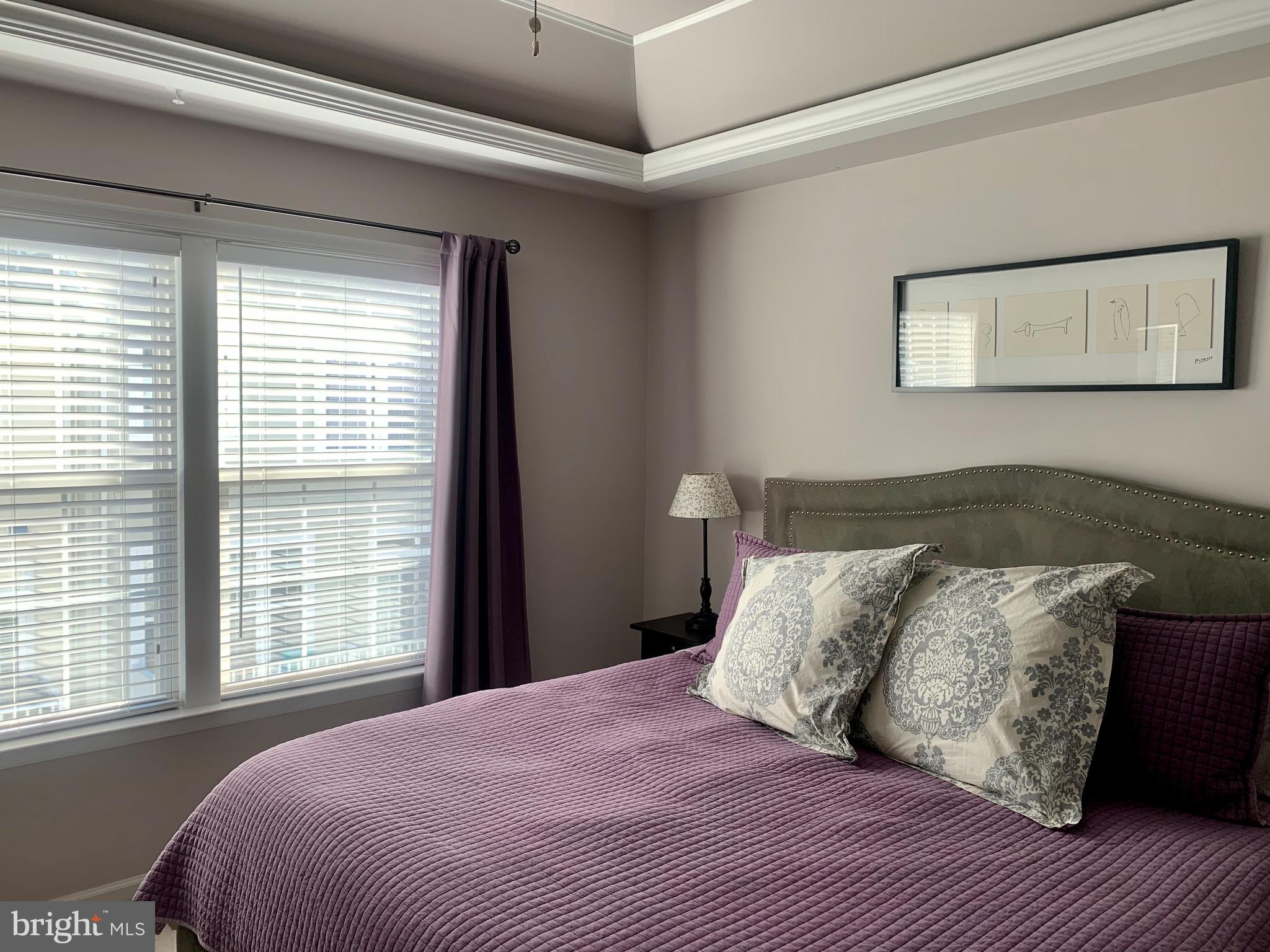 9823 Darcy Forest Drive Silver Spring, MD 20910 - Photo 16 of 32 a bedroom with a bed and a window