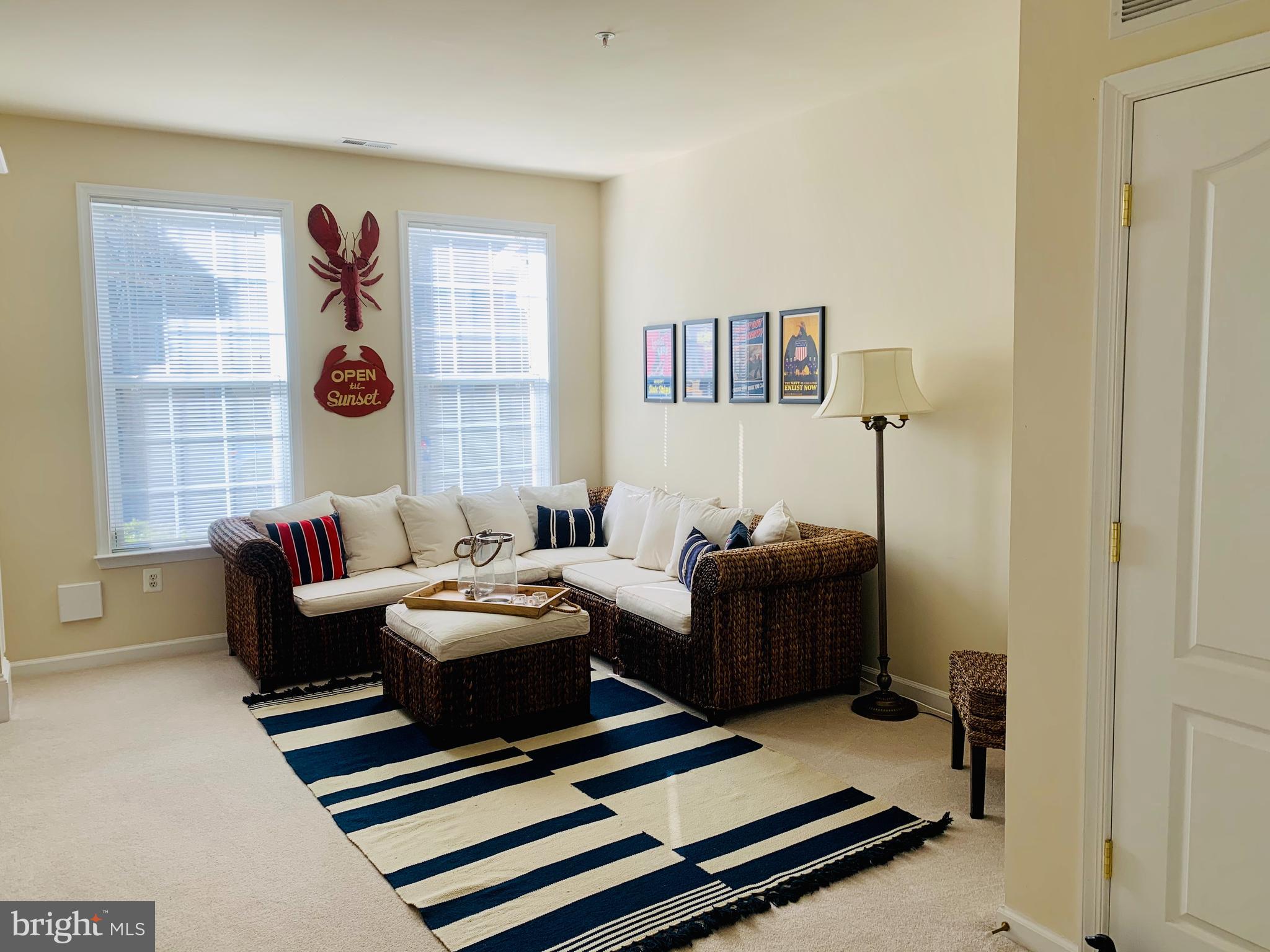 9823 Darcy Forest Drive Silver Spring, MD 20910 - Photo 2 of 32 a living room with furniture and a window