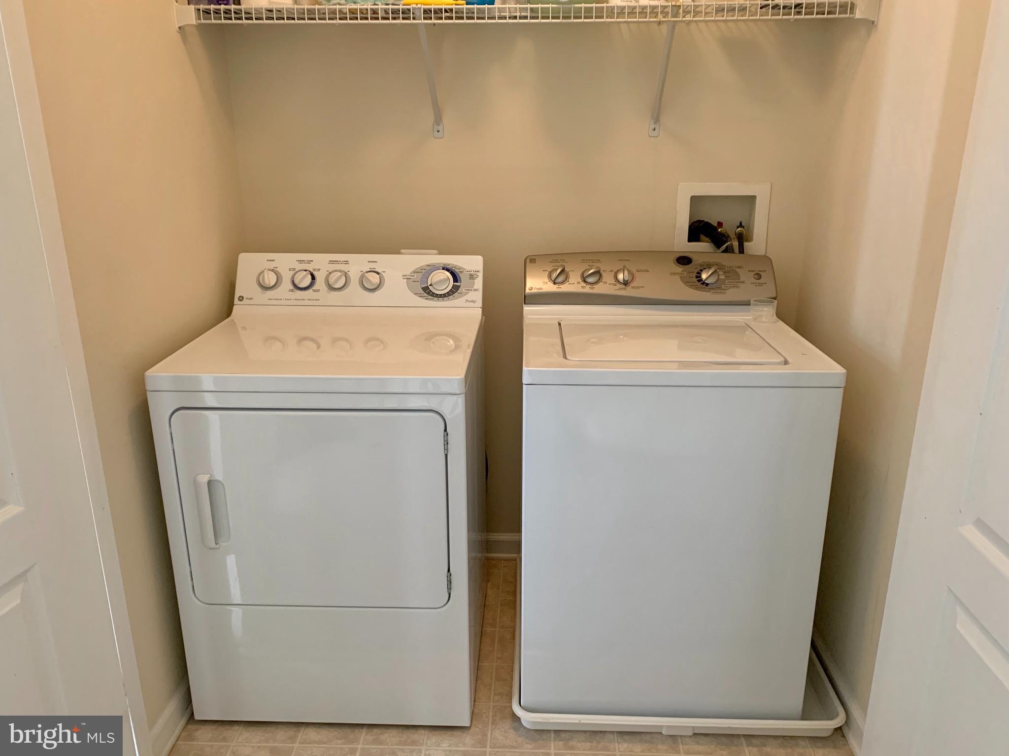 9823 Darcy Forest Drive Silver Spring, MD 20910 - Photo 25 of 32 a utility room with dryer and washer