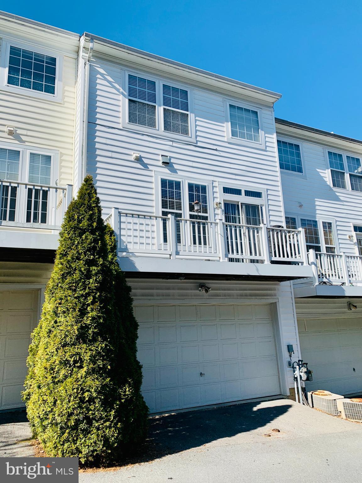 9823 Darcy Forest Drive Silver Spring, MD 20910 - Photo 26 of 32 a front view of a house with a garden