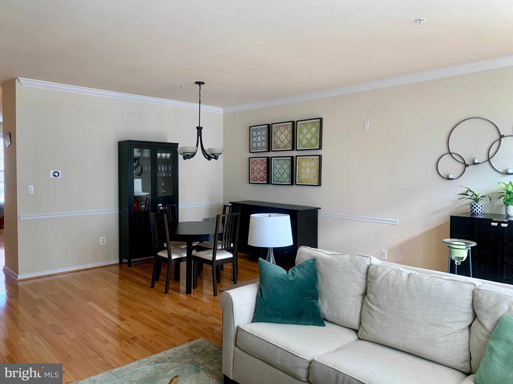 9823 Darcy Forest Drive Silver Spring, MD 20910 - Photo 6 of 32 a living room with furniture and wooden floor