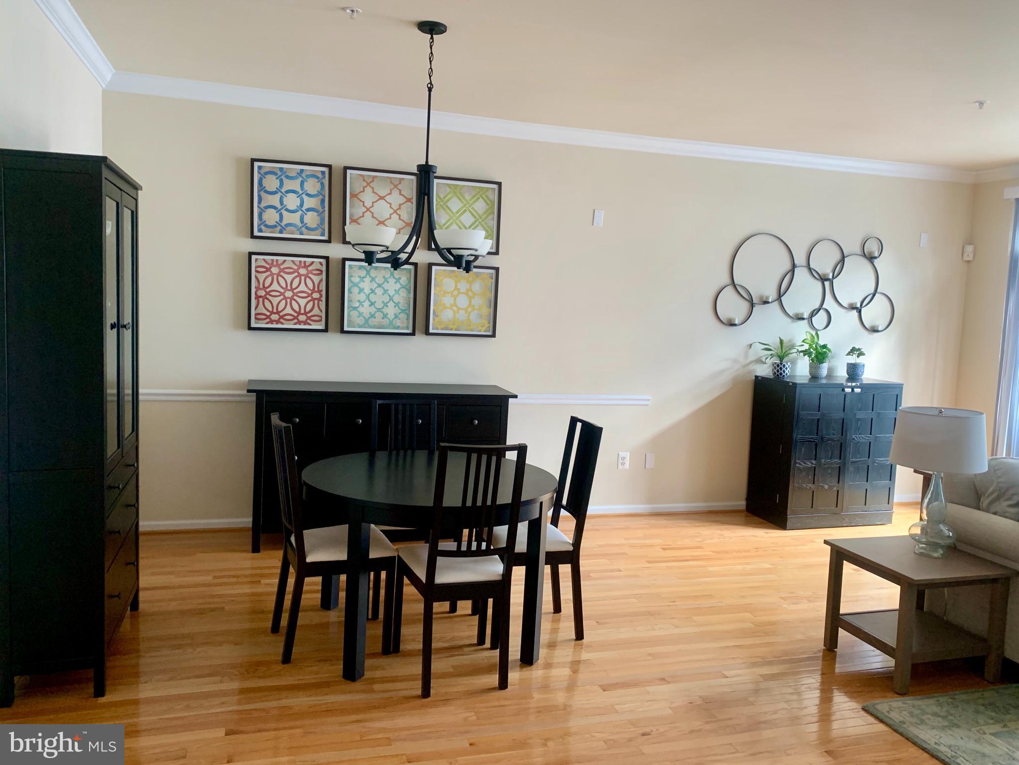 9823 Darcy Forest Drive Silver Spring, MD 20910 - Photo 7 of 32 a view of a dining room with furniture and wooden floor