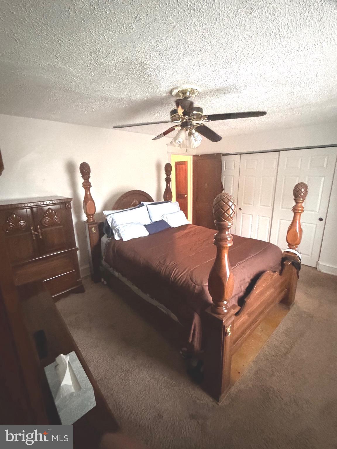 463 Burmont Road Drexel Hill, PA 19026 - Photo 21 of 39 a bedroom with a bed and a chandelier